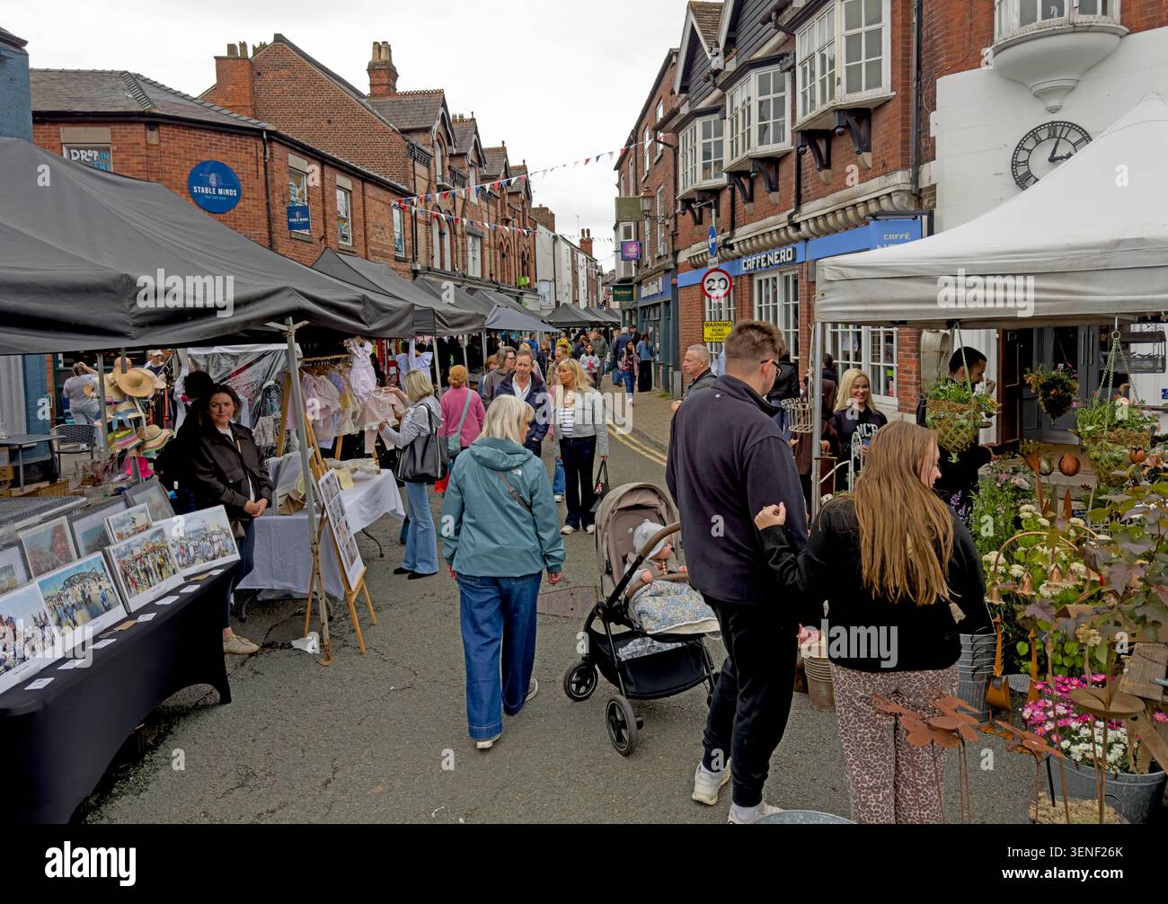 Friendly Knutsford Makers Market stalls on Princess Street and Silk Mill Street, Cheshire, with shoppers browsing on a Sunday Stock Photo