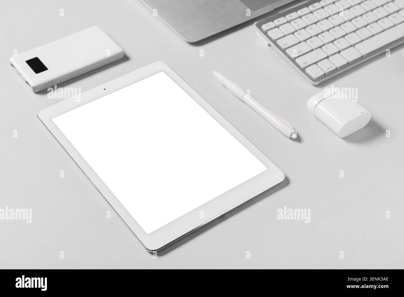 Tablet computer with different modern gadgets on grey background Stock Photo