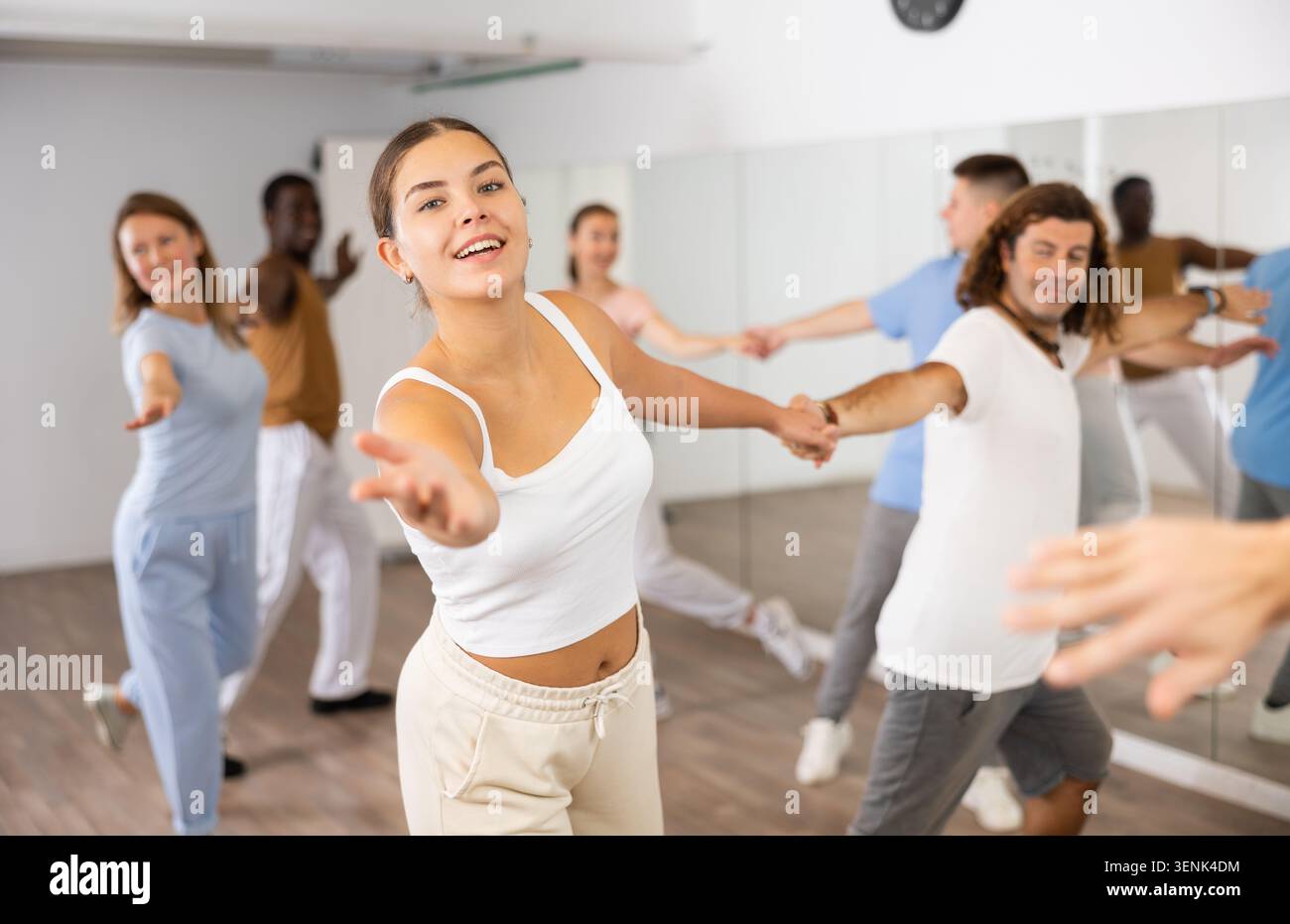 Adult couples dancing active dance together in studio Stock Photo