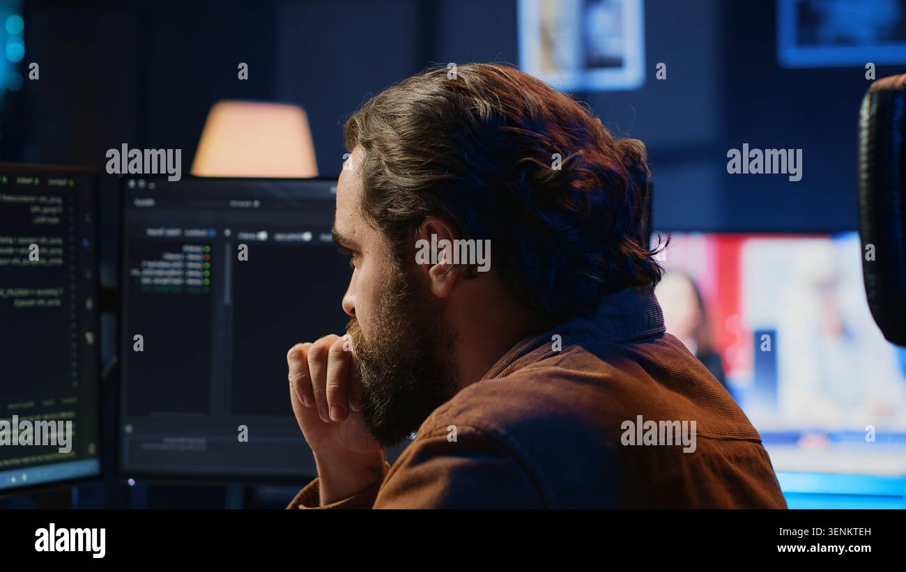 Developer overthinking solutions while doing programming during remote job shift in home office. IT admin working on computer in apartment late at night, thinking how to fix bugs, camera A close up. Stock Photo