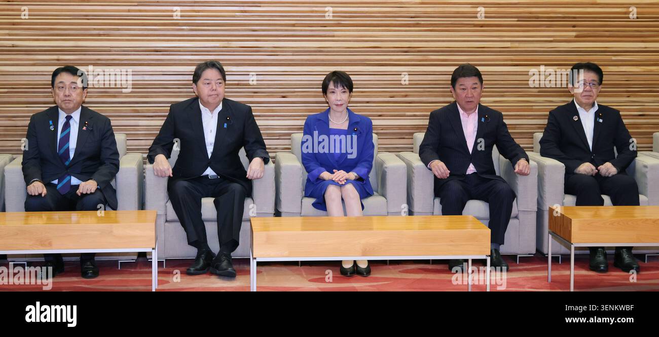 Japanese Prime Minister Sanae Takaichi (C) attends a cabinet meeting in ...