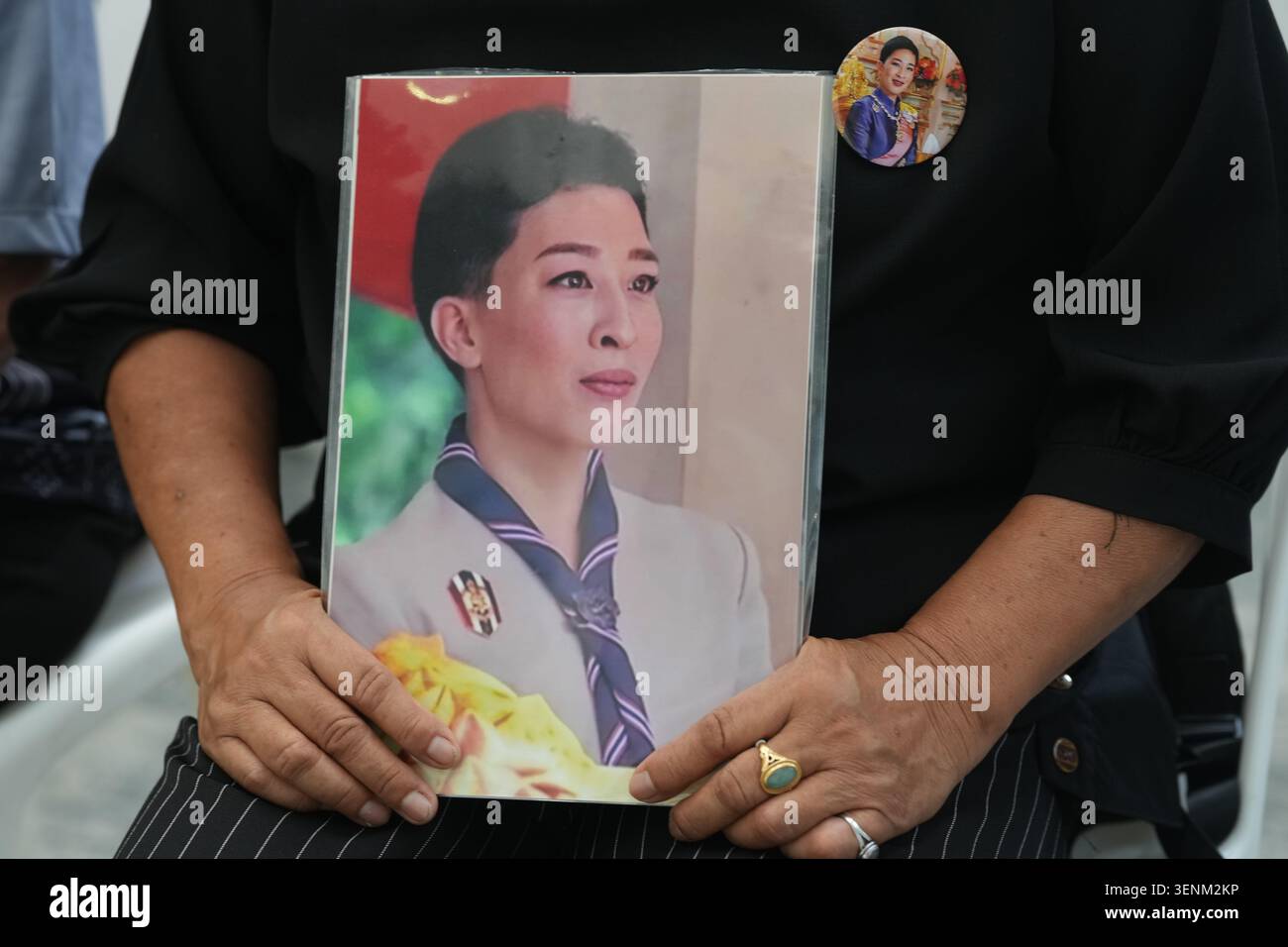 a-woman-holds-a-picture-of-thailand-s-princess-bajrakitiyabha-in