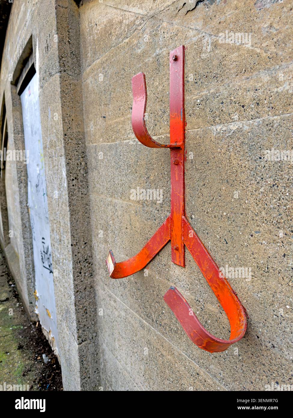 Empty holder for a life ring or ring buoy mounted on a stone wall in Latchford, Warrington, England, UK. Stock Photo