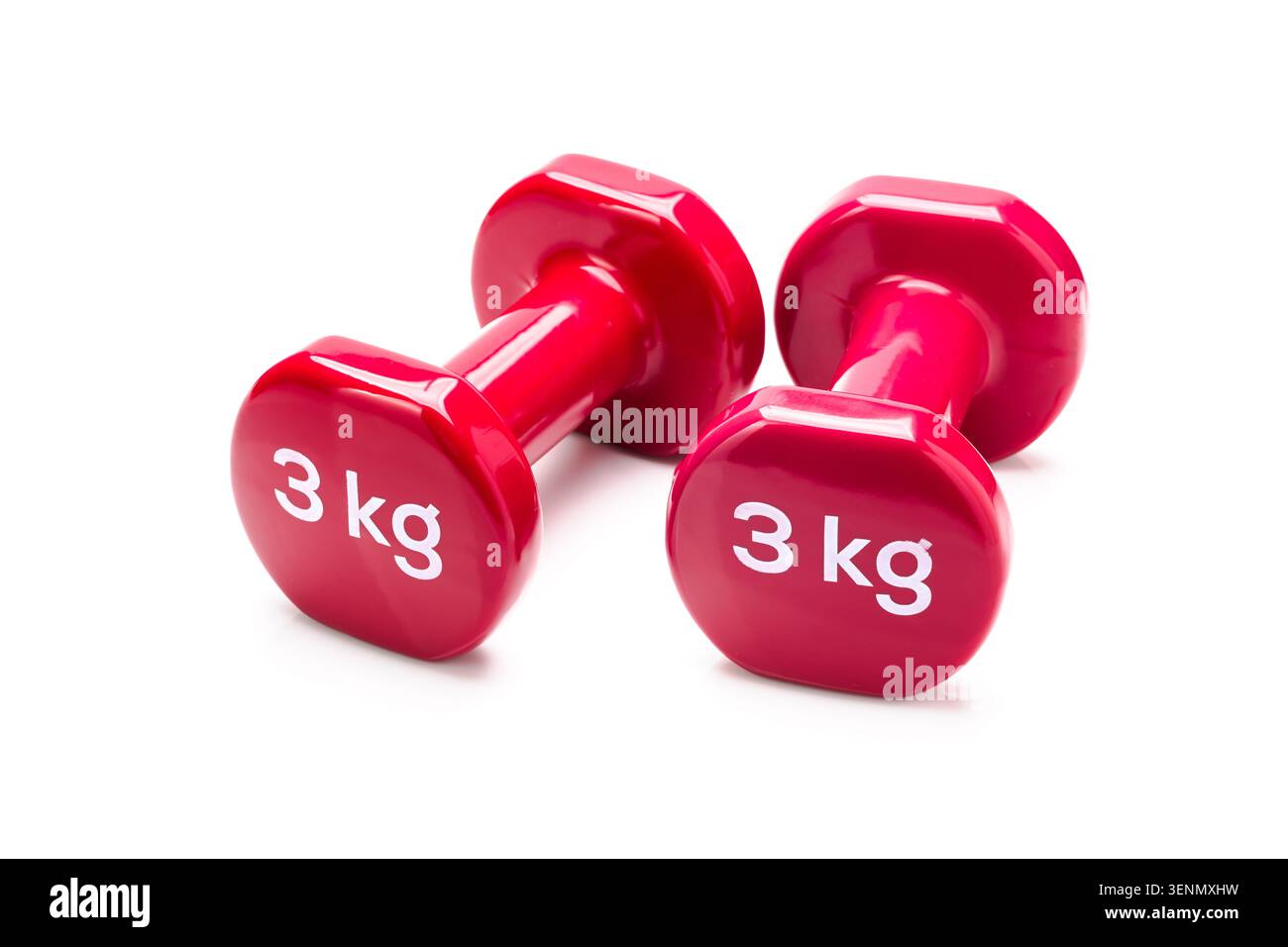 Red 3 kilogram dumbbells isolated on white background for fitness and exercise concepts Stock Photo