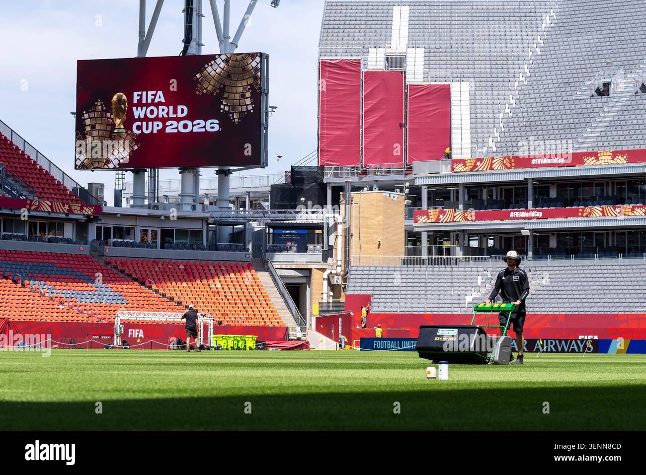 A worker mows the grass at Toronto Stadium in preparation for FIFA ...