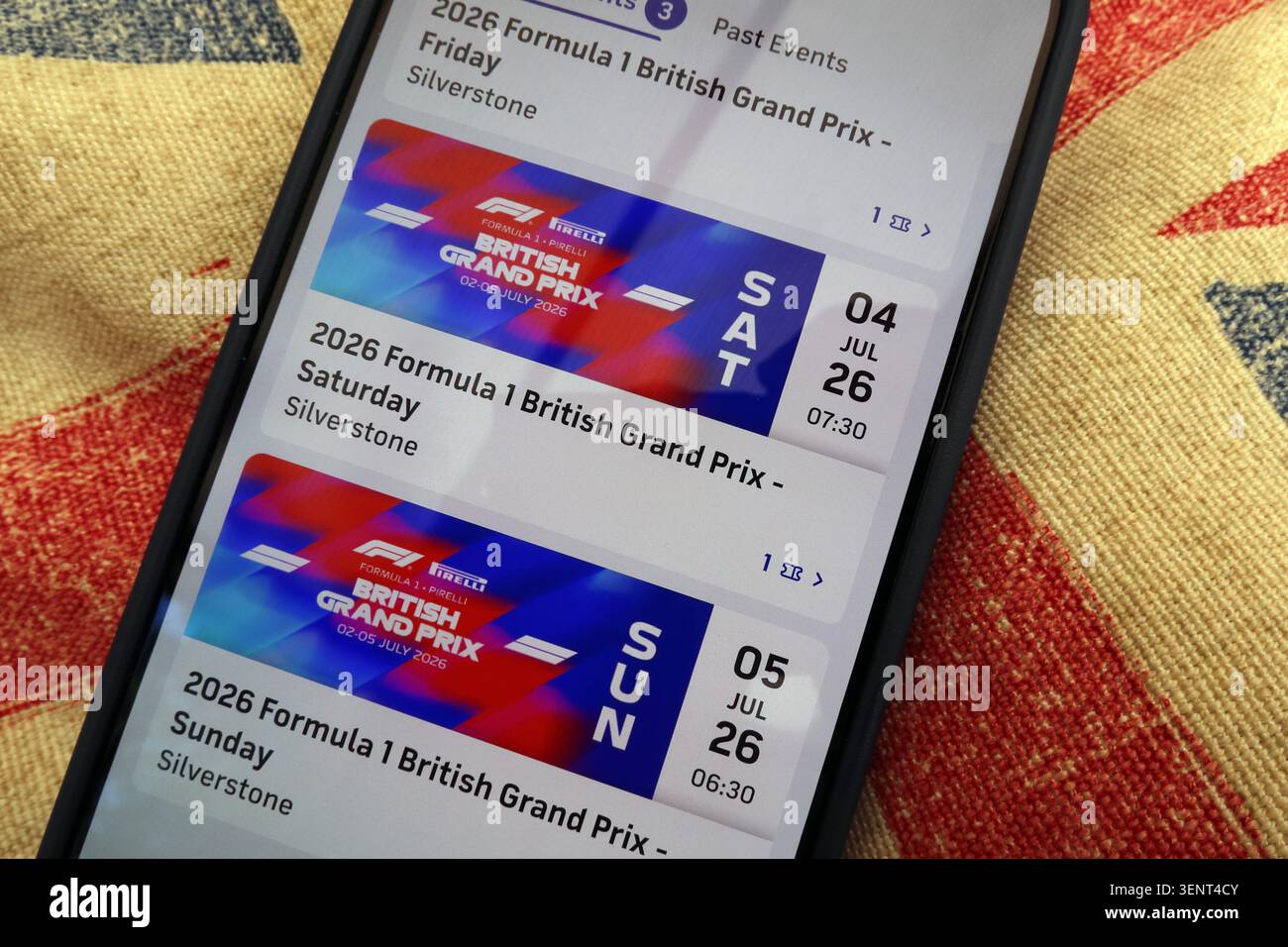 Digital 2026 British Grand Prix tickets on an iPhone, illustrating Silverstone entry, online resale risks and ticket fraud awareness. Stock Photo