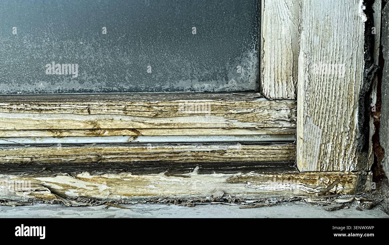 Close-Up of Weathered Window Frame with Peeling Paint and Texture Details Stock Photo