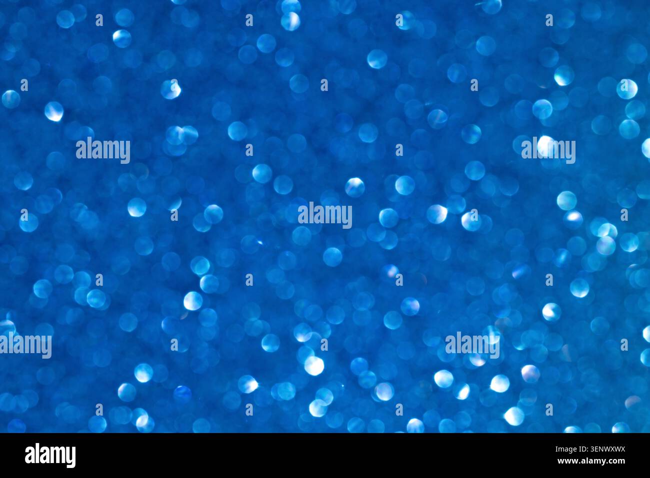 Vibrant Blue Bokeh Background with Shimmering Light Patterns Stock Photo