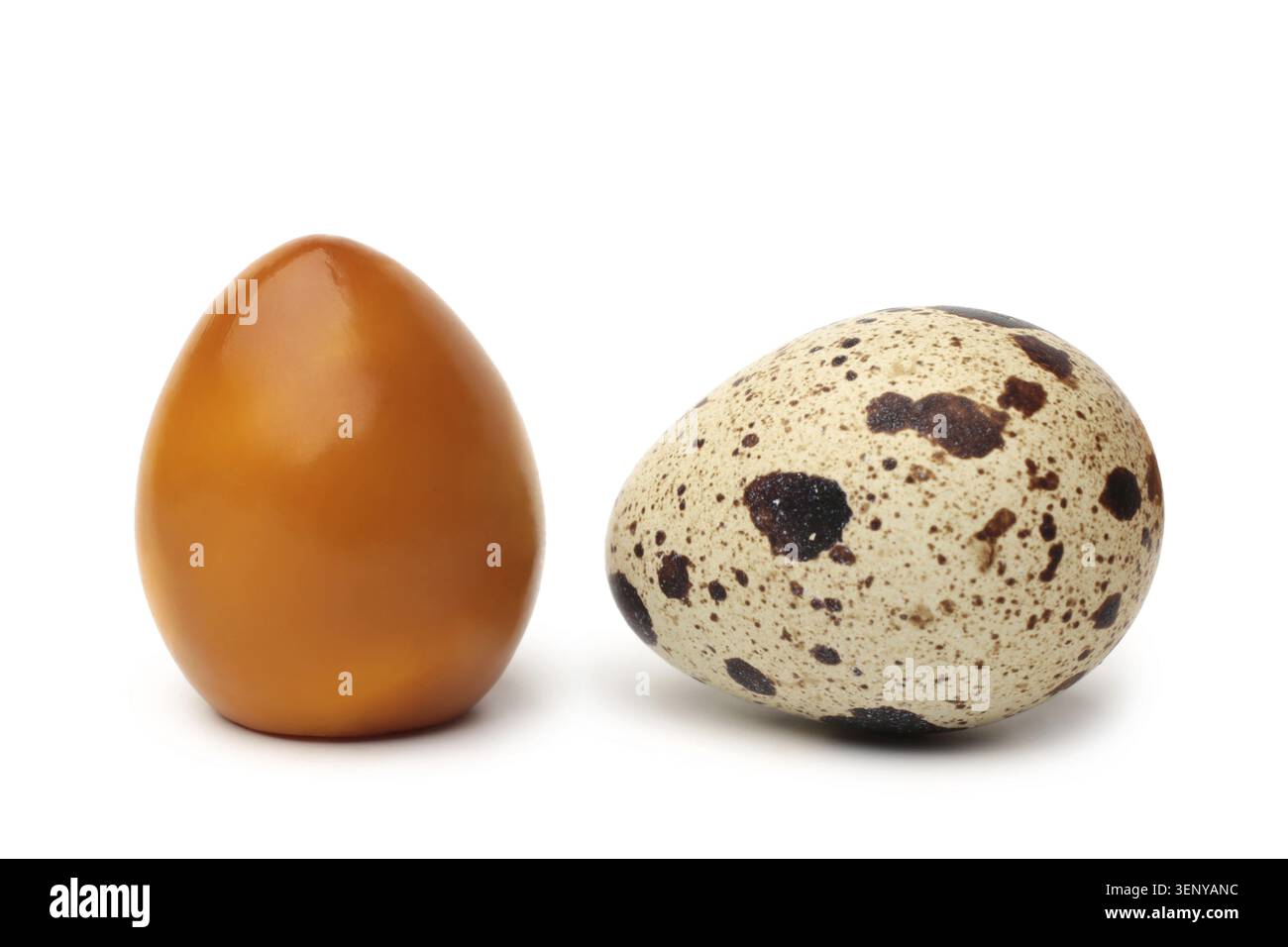 Smoked and raw quail eggs on white background Stock Photo