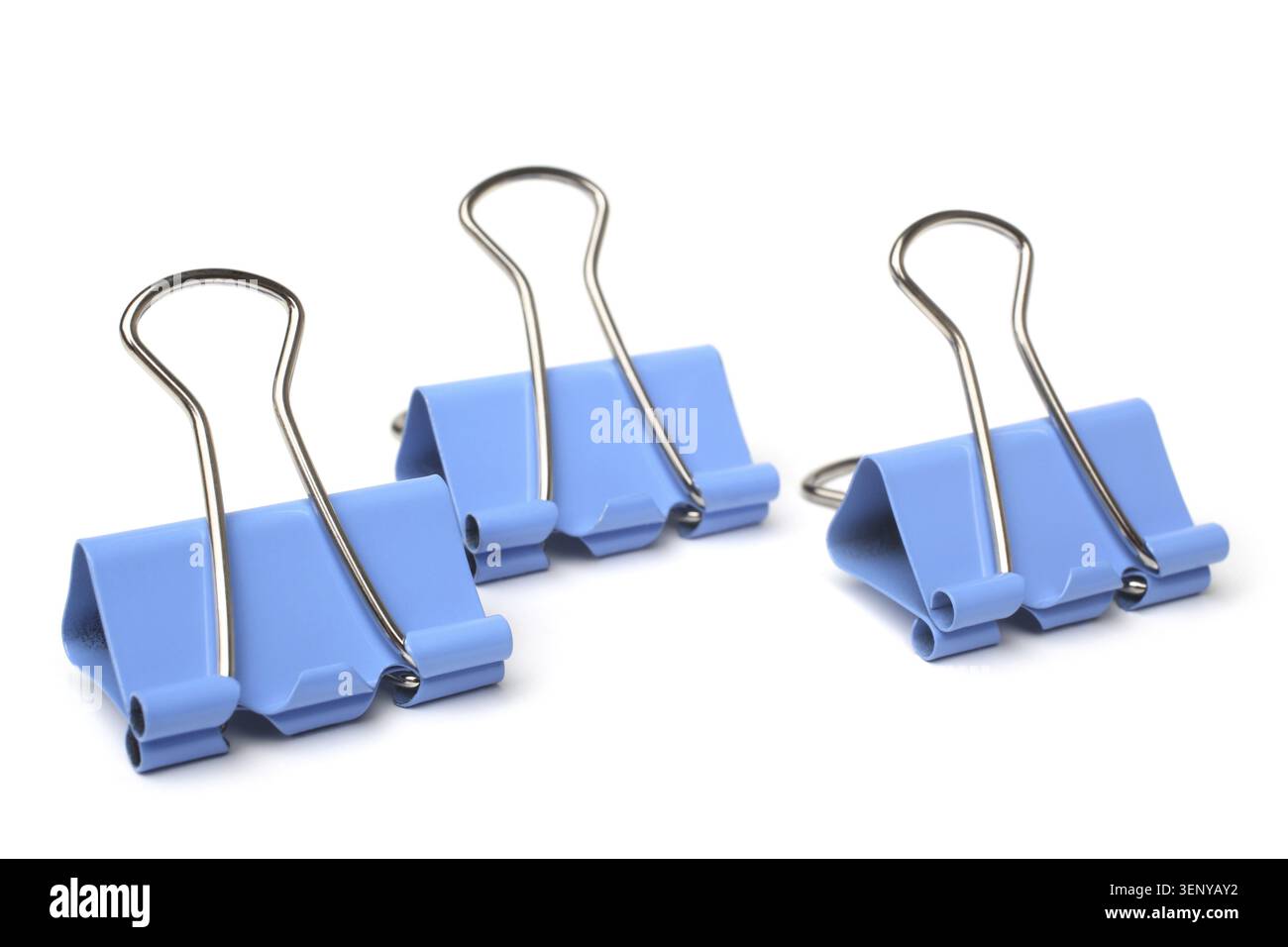 Blue paper clips on white background Stock Photo