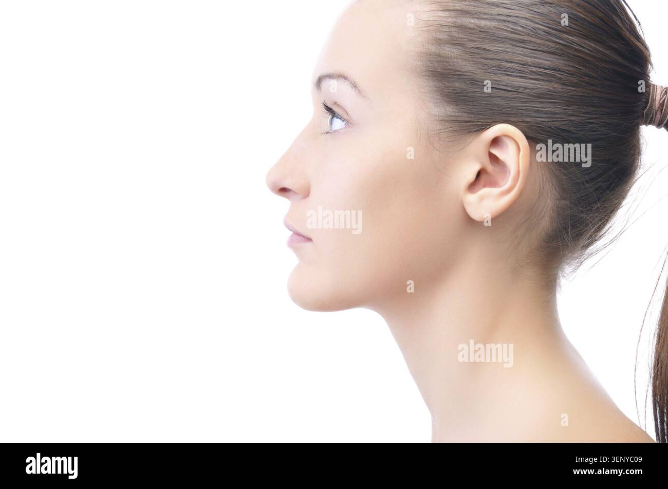 Happy beautiful young woman is looking sideways isolated on white Stock Photo