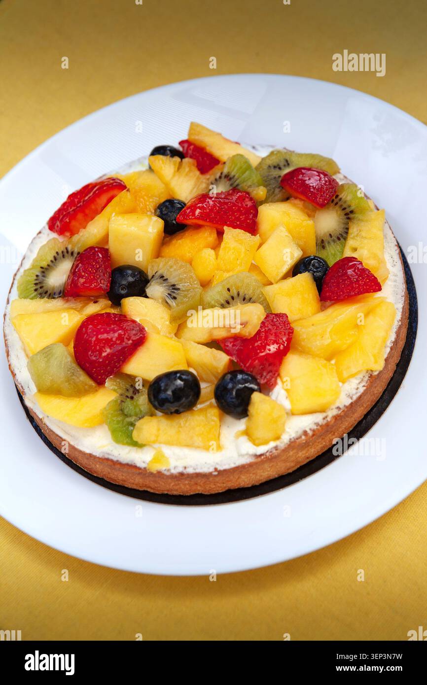 Fresh fruit tart in a white plate Stock Photo