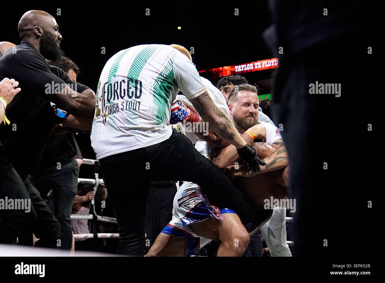 Anthony Taylor is struck by a member of Matty Floyd's corner during ...