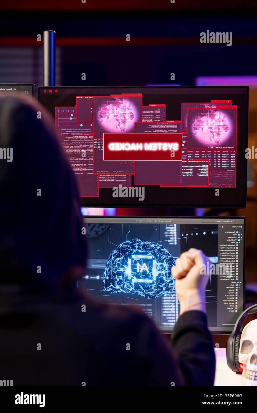 Hacker receiving system hacked message after attacking PCs using AI malware software while rogue software developer in secret lair trying to hide online activity after stealing data. Stock Photo