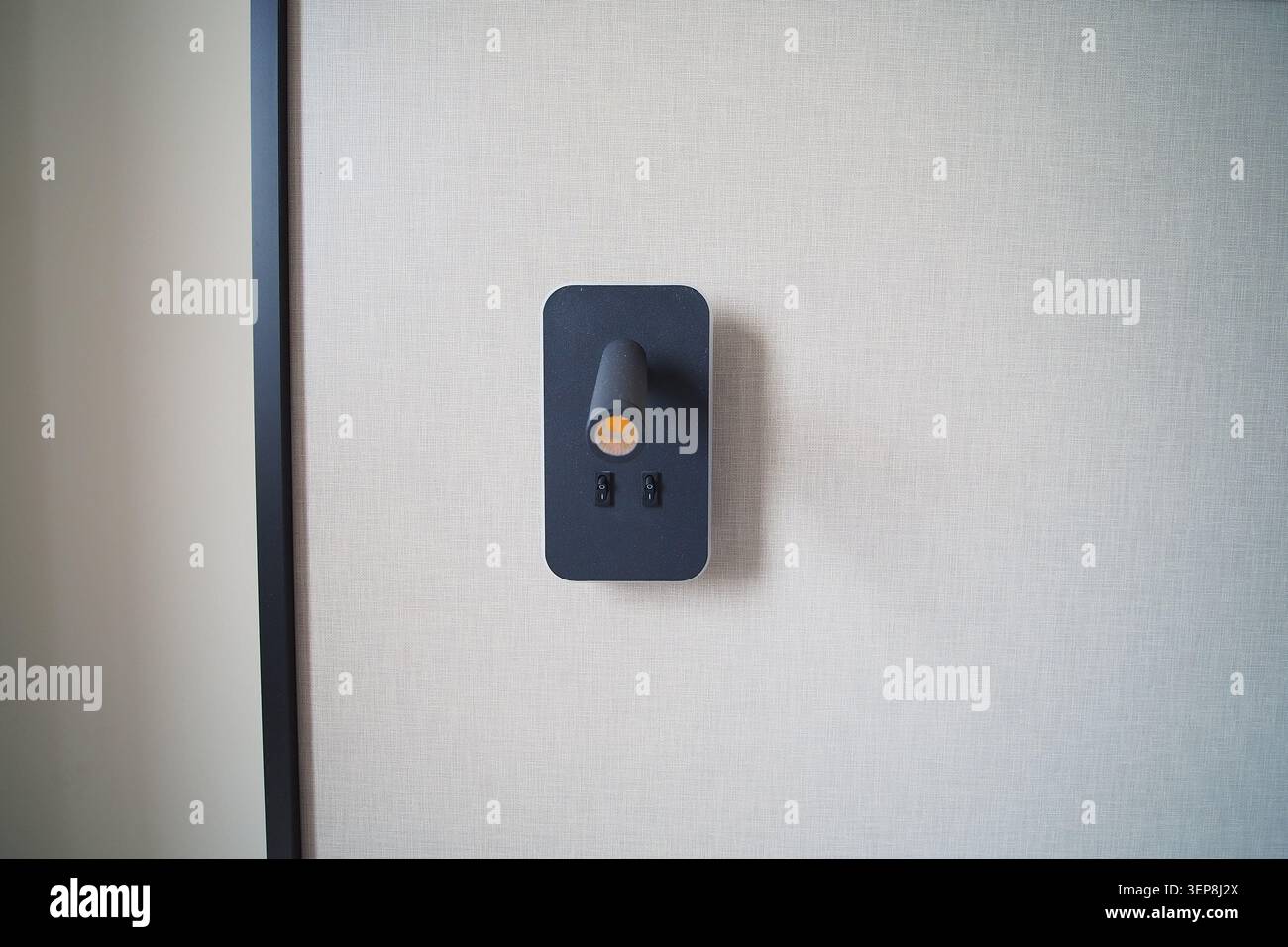 Light switch on a wall in a modern room Stock Photo