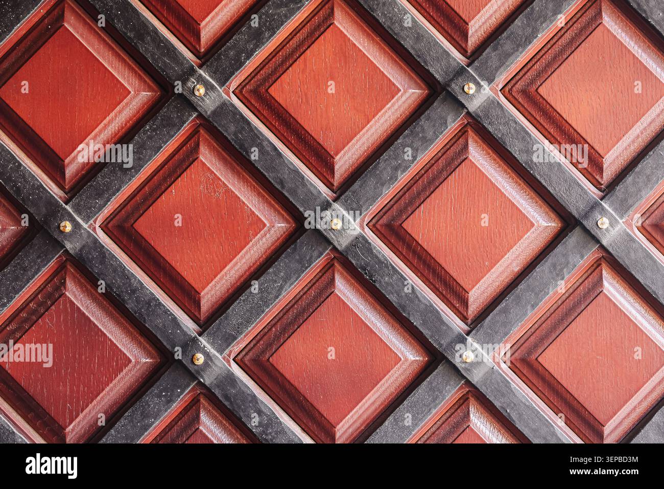 Decorative wooden panel with geometric square pattern. Abstract architectural texture background with repeating design elements. Stock Photo