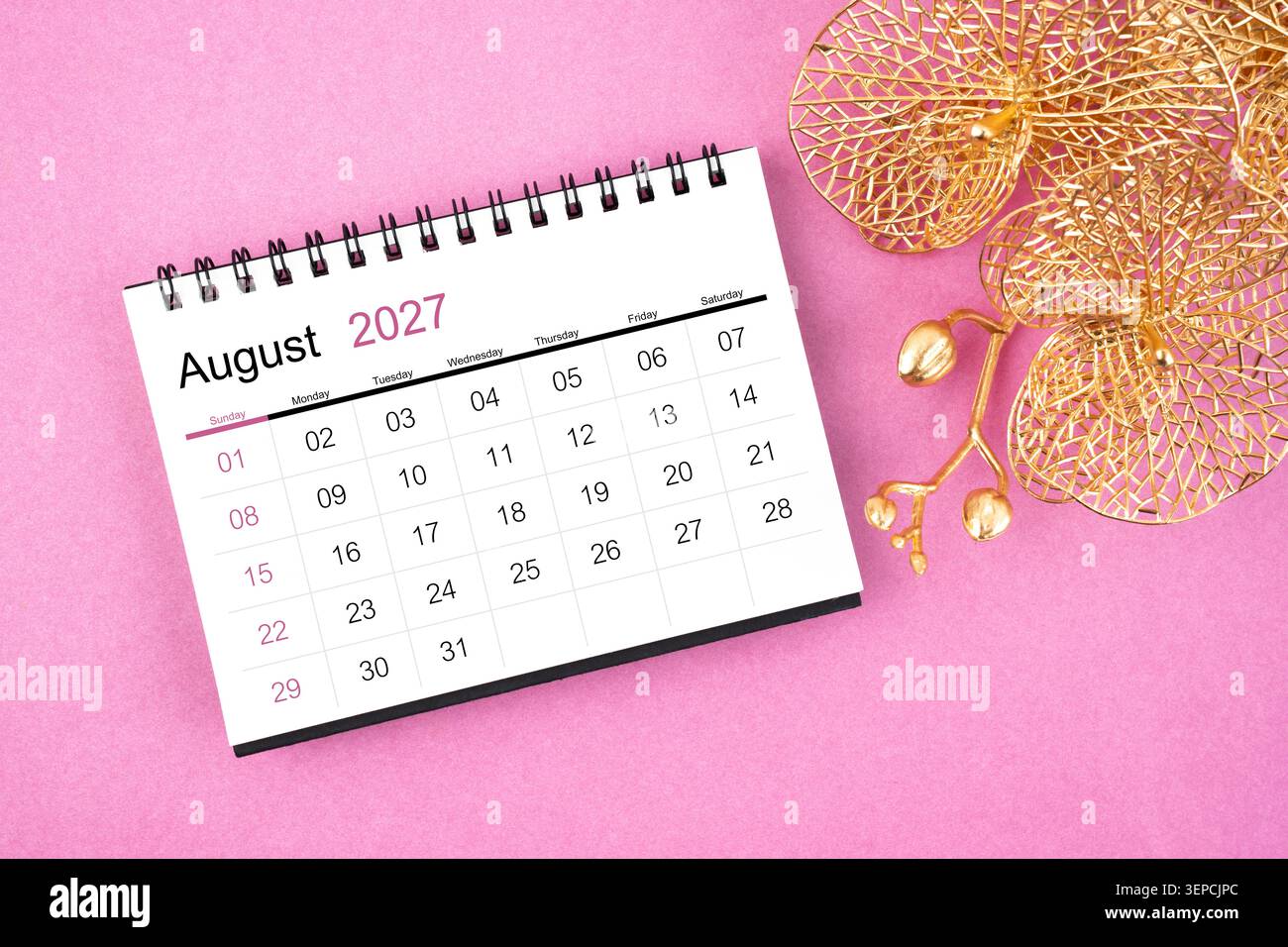 August 2027 desk calendar on yellow background, Front view Stock Photo - Alamy
