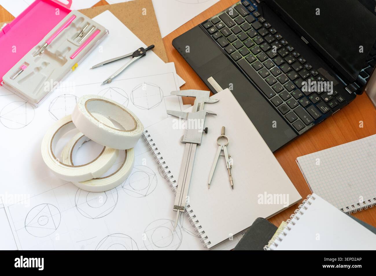 Study Workspace Laptop, Technical Drawings, Vernier Caliper, Compasses Stationery Tool Top view architect desk Geometric sketches dividers. Professional engineering and drafting Stock Photo