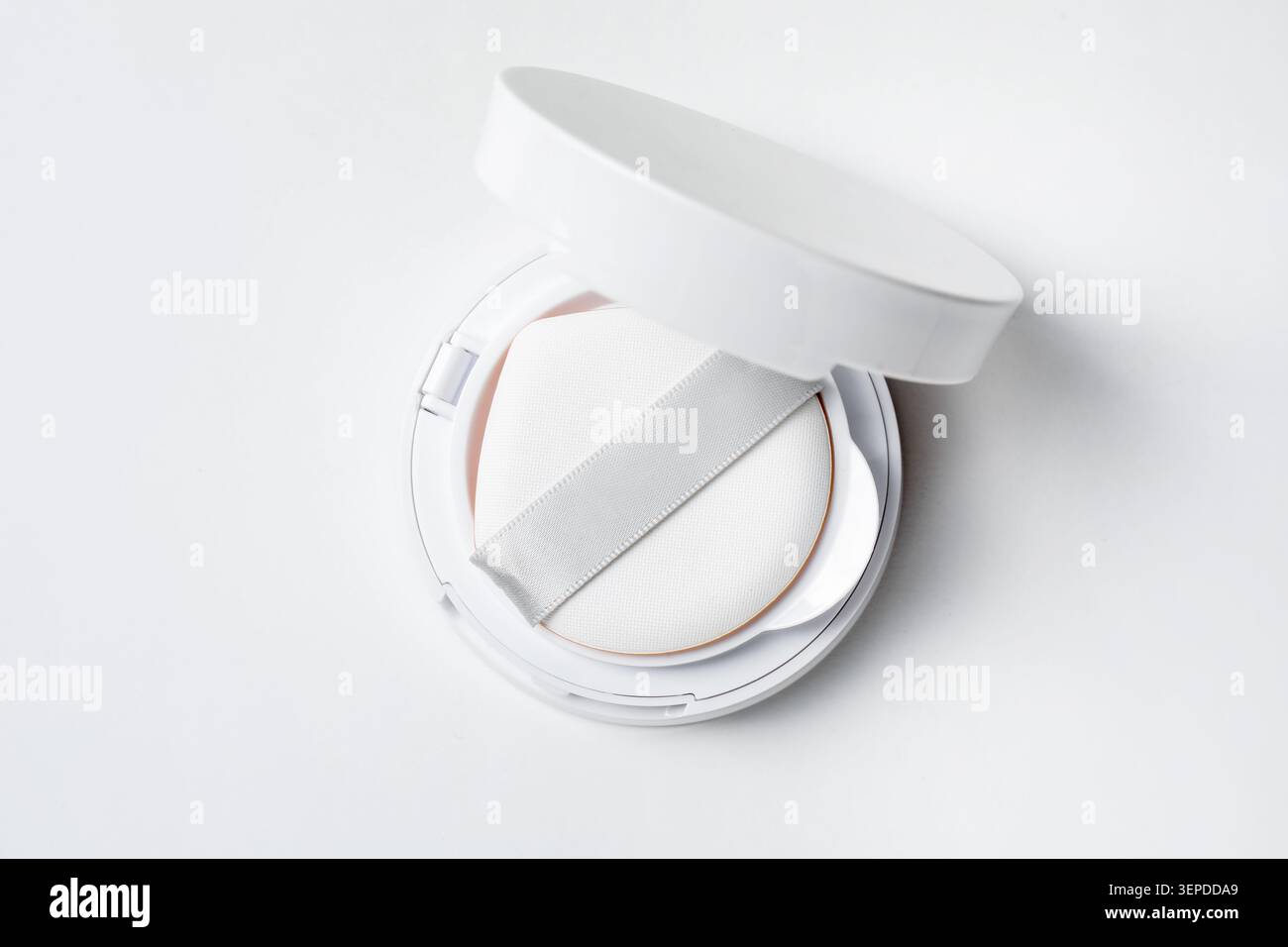 Cushion foundation on white background, top view. Makeup product Stock Photo