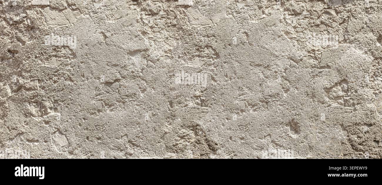 Rough gray concrete wall surface showing a textured background Stock Photo