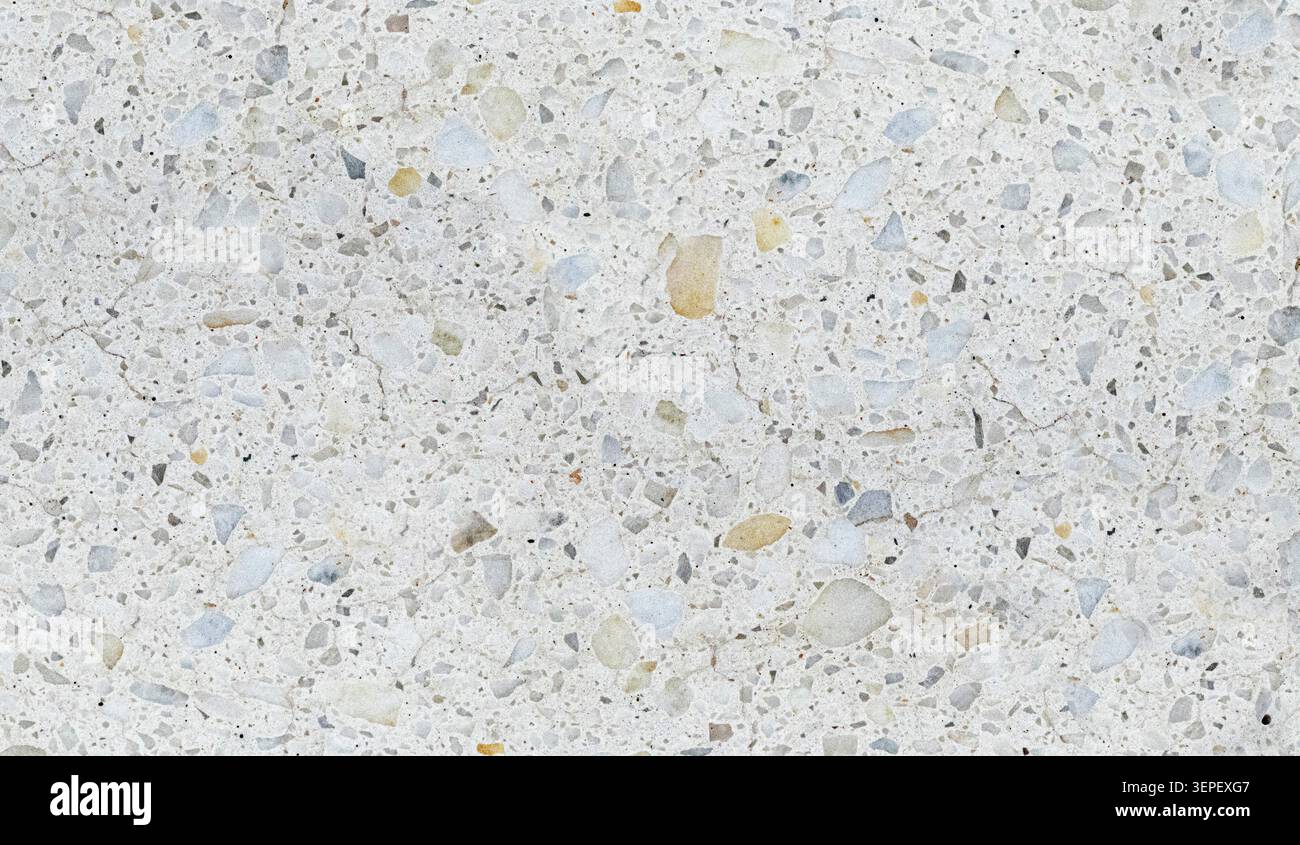 Terrazzo concrete surface showing fragmented stone chips and subtle cracking Stock Photo