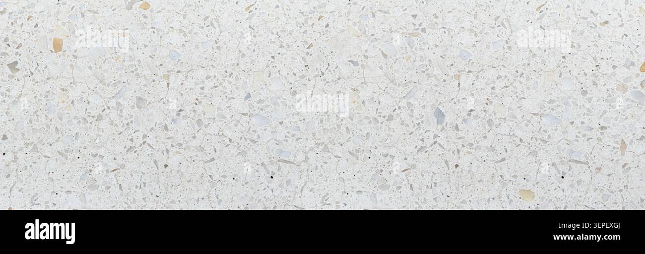 Terrazzo pattern creating a textured background with white, gray, and brown flecks Stock Photo