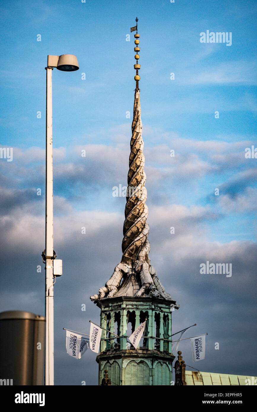 The iconic twisted dragon tail spire of Børsen (Copenhagen Stock Exchange), Copenhagen, Denmark. Historic landmark built 1619–1640. Stock Photo