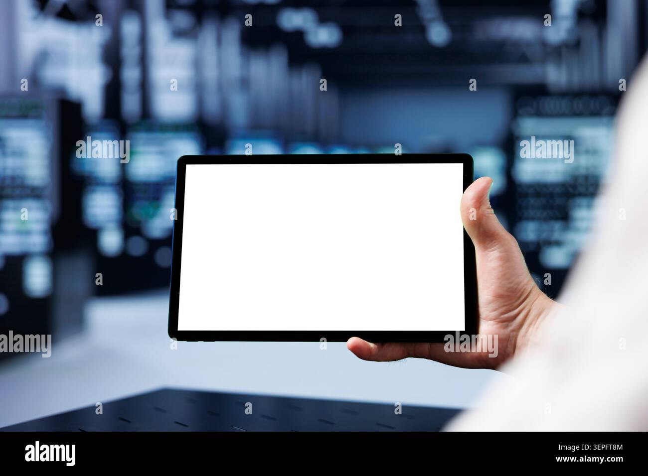 Adept IT developer using mockup tablet to check operational server rows, close-up; racks in computer network security data center providing processing and memory resources for several workloads. Stock Photo