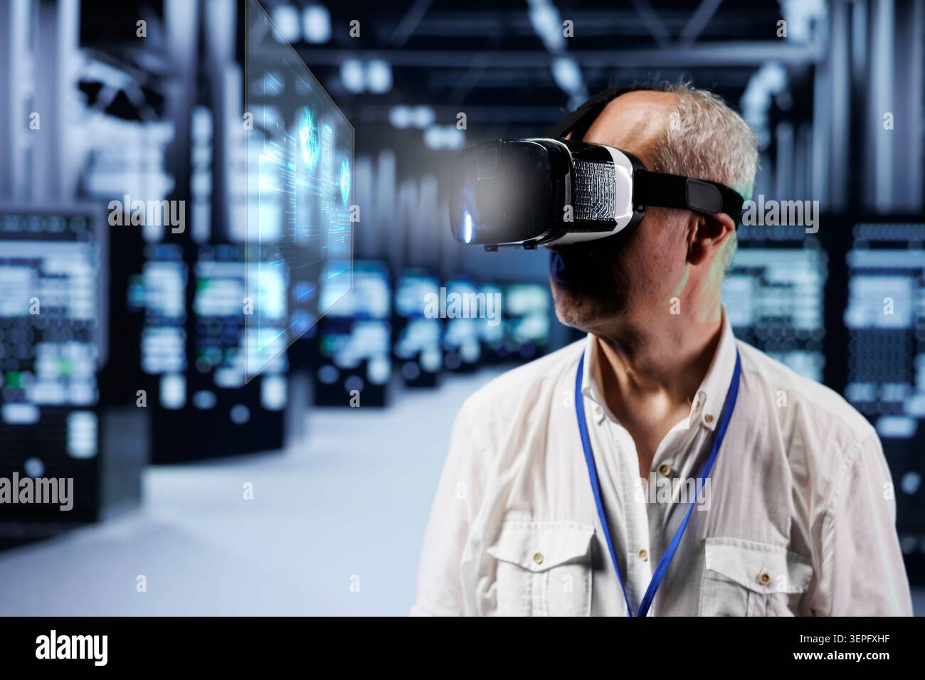 Old cloud computing business executive immersed in virtual reality at data center, doing equipment maintenance. Stock Photo