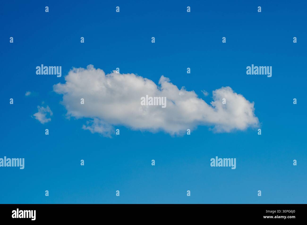 Fluffy White Cloud In Bright Summer Sky Stock Photo