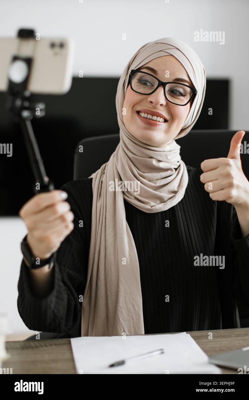 Woman Vlogging with Selfie Stick Stock Photo