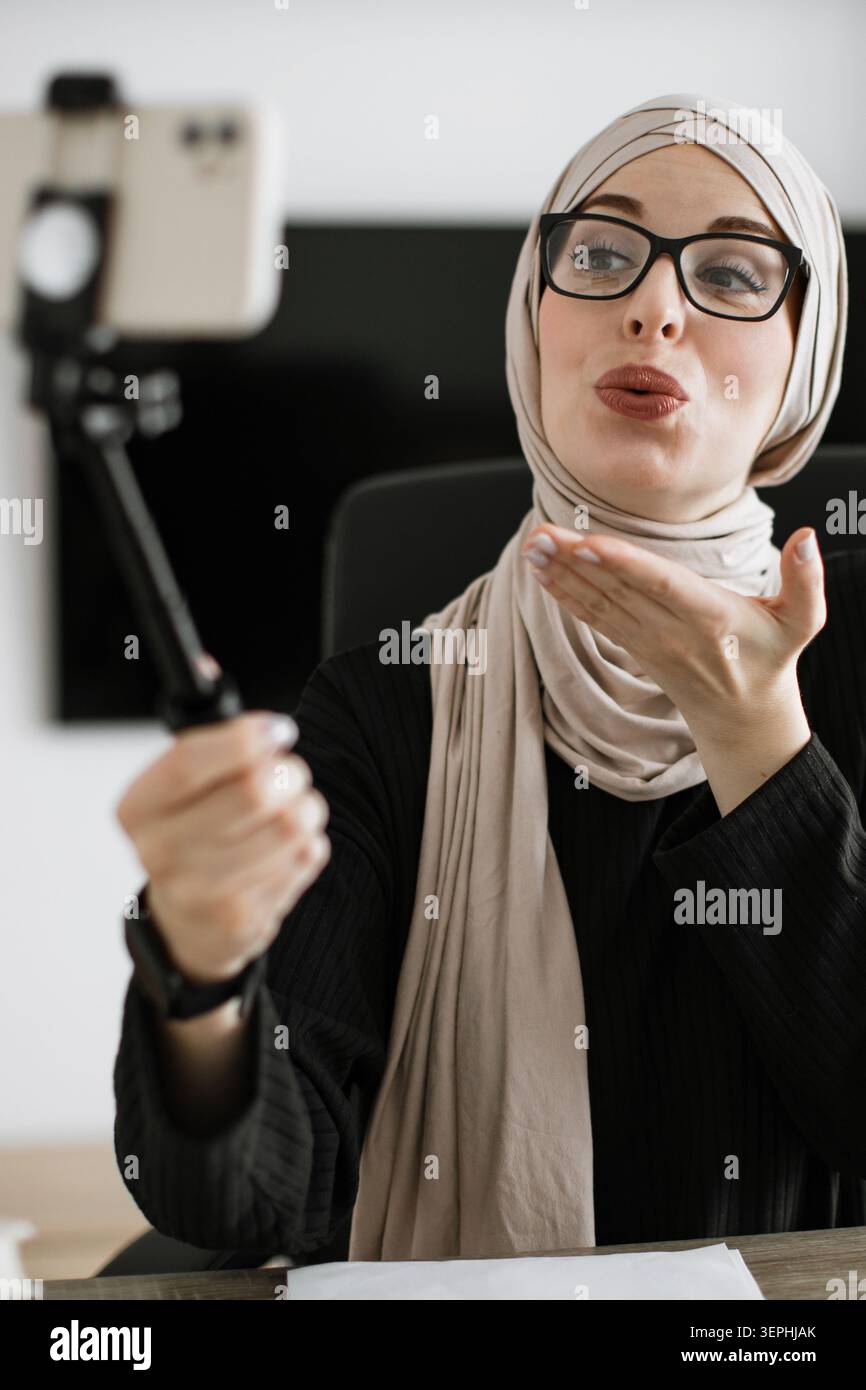 Woman Vlogging with Selfie Stick Stock Photo