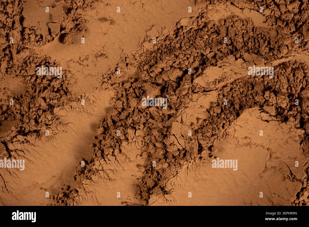 Top view of aromatic chocolate powder with artistic swirls and patterns. Stock Photo