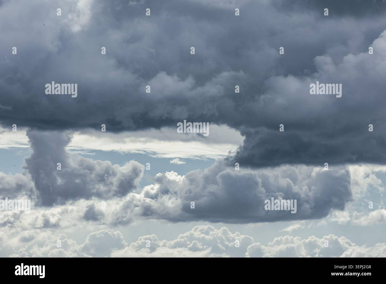 Dramatic sky. Dark gray overcast clouds background photo Stock Photo