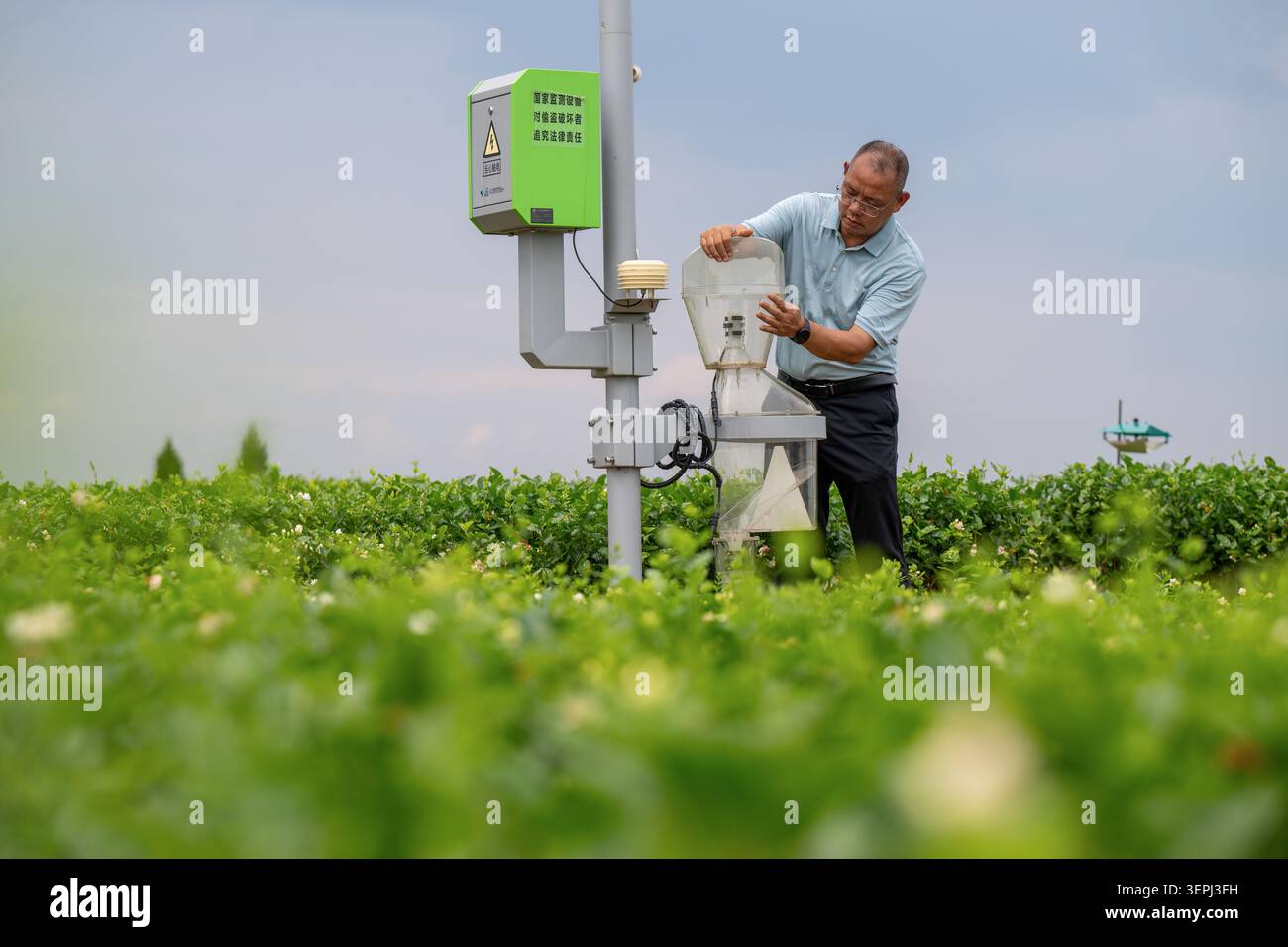 Agricultural technicians inspect smart monitoring equipment at China ...