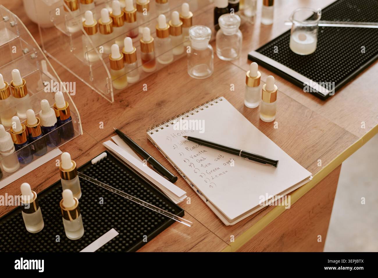 Cosmetic Product Samples Arranging for Fragrance Testing and Development Stock Photo