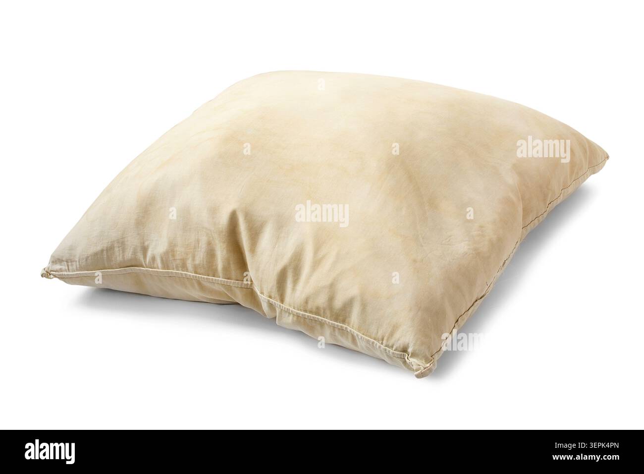 Old yellow feather pillow isolated on white background Stock Photo