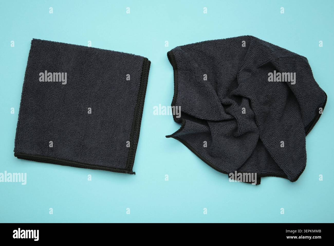 Microfiber cloth for cleaning and dusting on blue background. Top view Stock Photo
