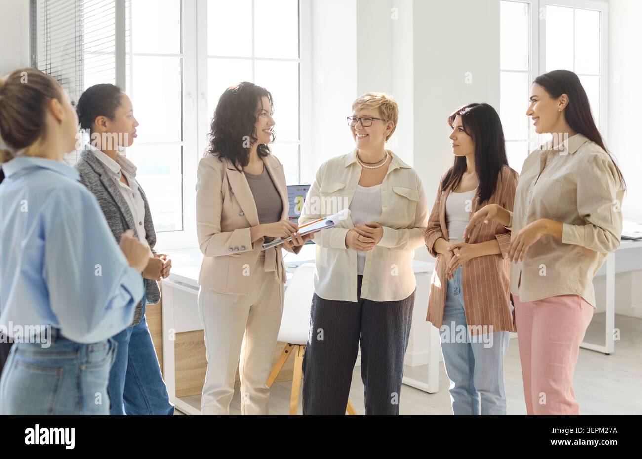 Female professionals in office discussing strategy, mentoring teamwork and planning Stock Photo