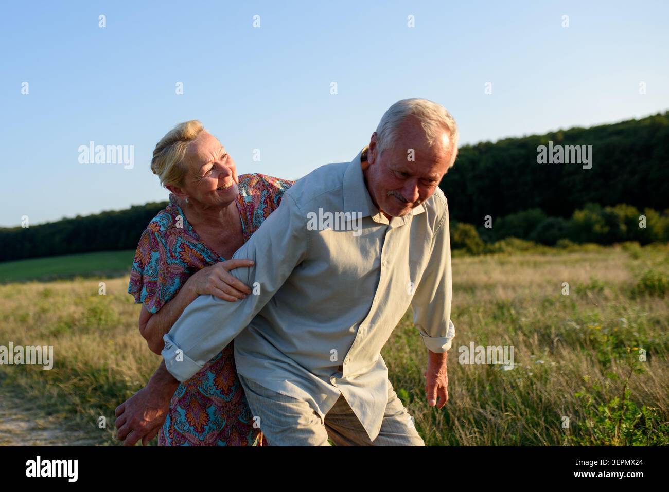 Elderly man and woman spending time in nature. Stock Photo