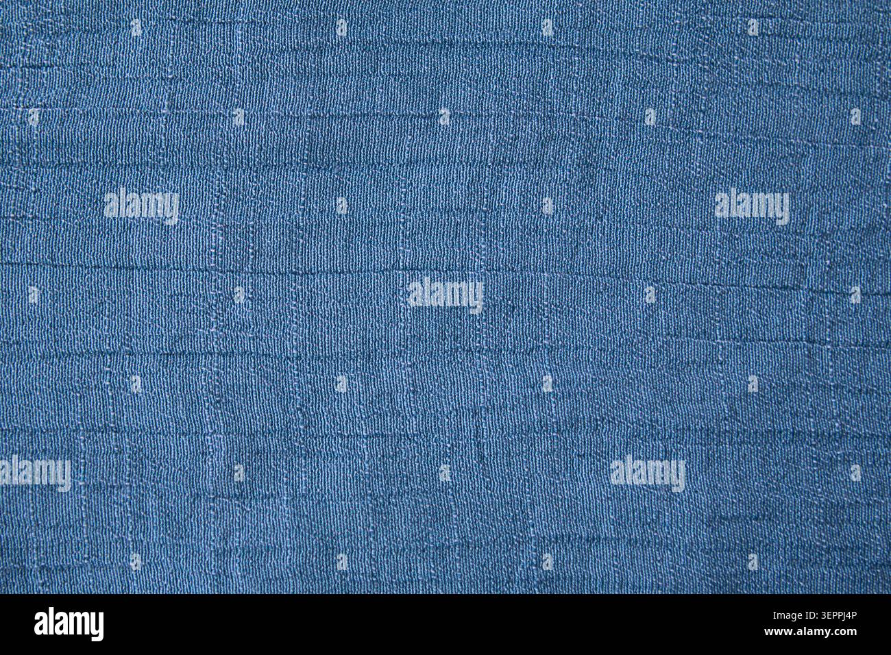 Blue woven fabric texture background with subtle grid pattern for design use Stock Photo