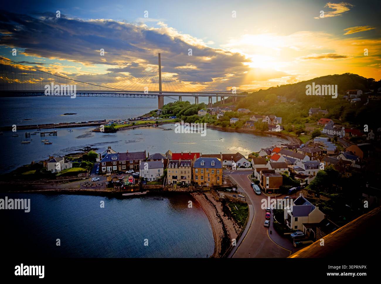 North Queensferry sunset view across the Firth of Forth towards the Queensferry Crossing, Fife, Scotland, UK. Stock Photo