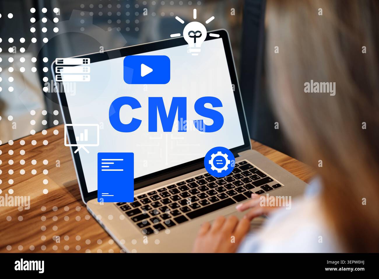 Using a content management system on a laptop for website management and design tasks Stock Photo
