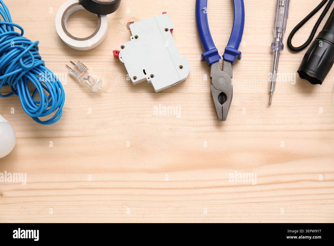Electricians tools and electronics on wooden background Stock Photo
