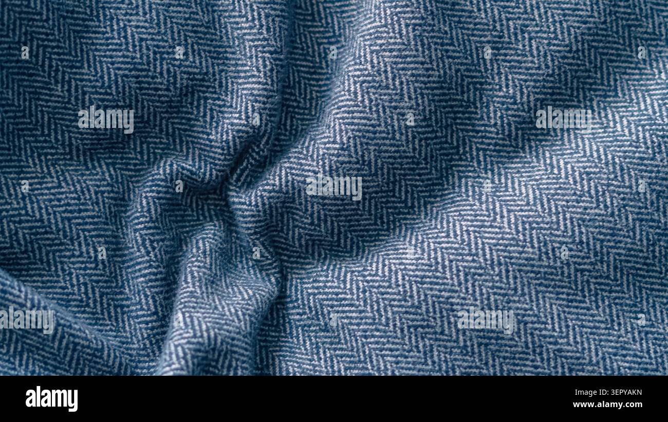 Blue crumpled herringbone fabric texture close up. Stock Photo