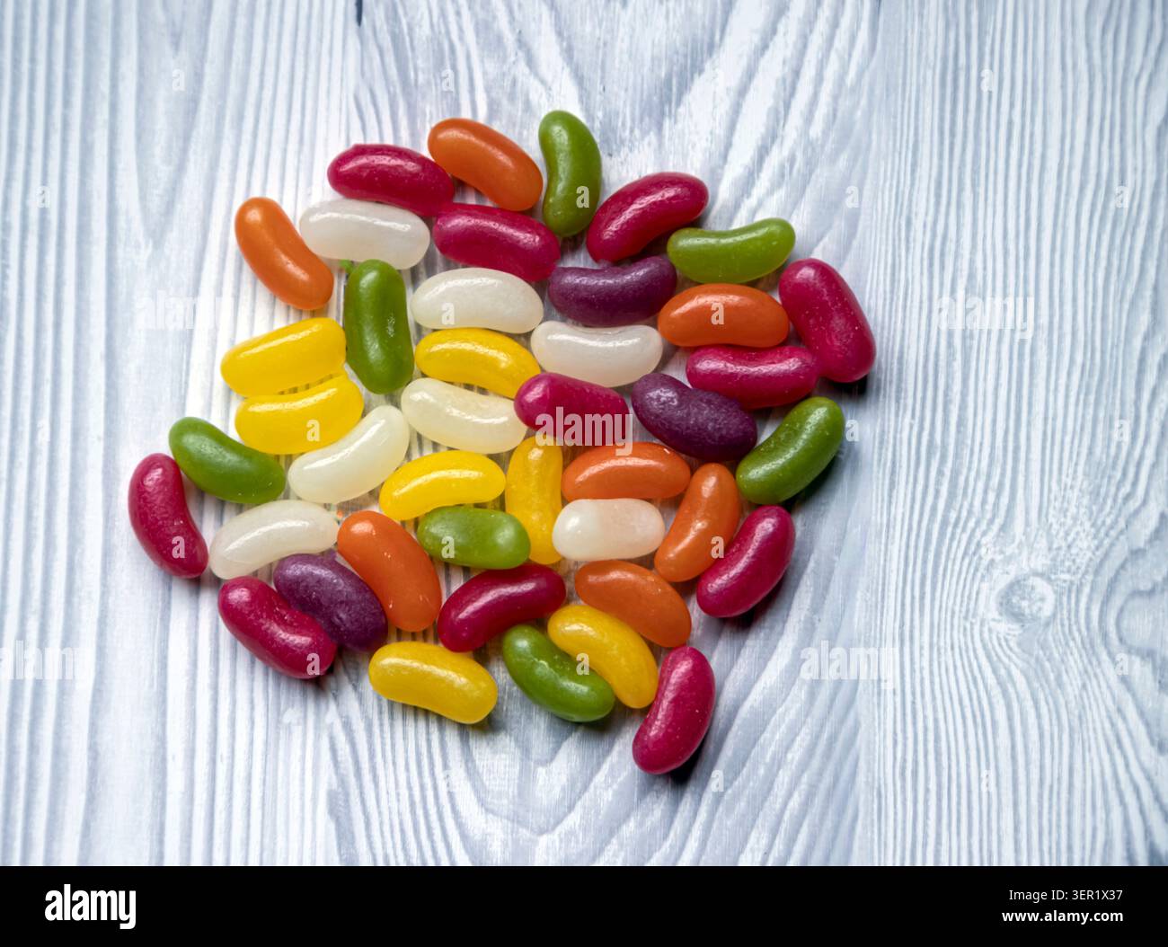 Selection of multicoloured loose jellybeans. Stock Photo