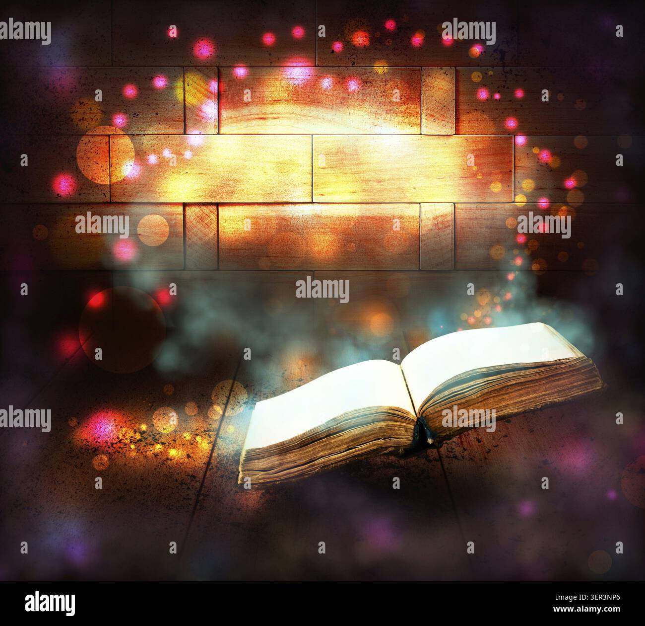 Old book with magic Ray of light Stock Photo