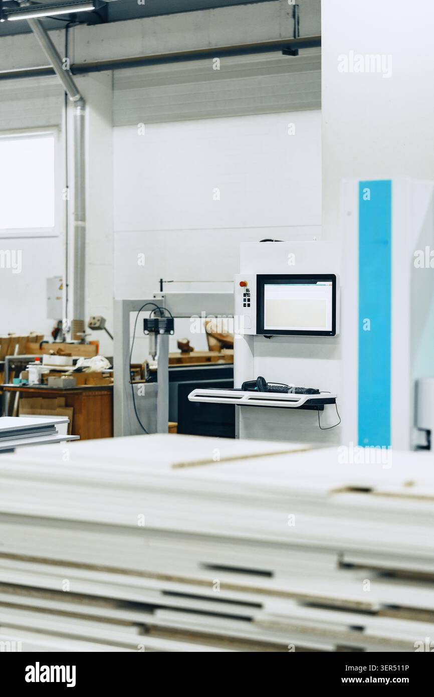 Furniture workshop layout with tools and equipment in use during working hours Stock Photo
