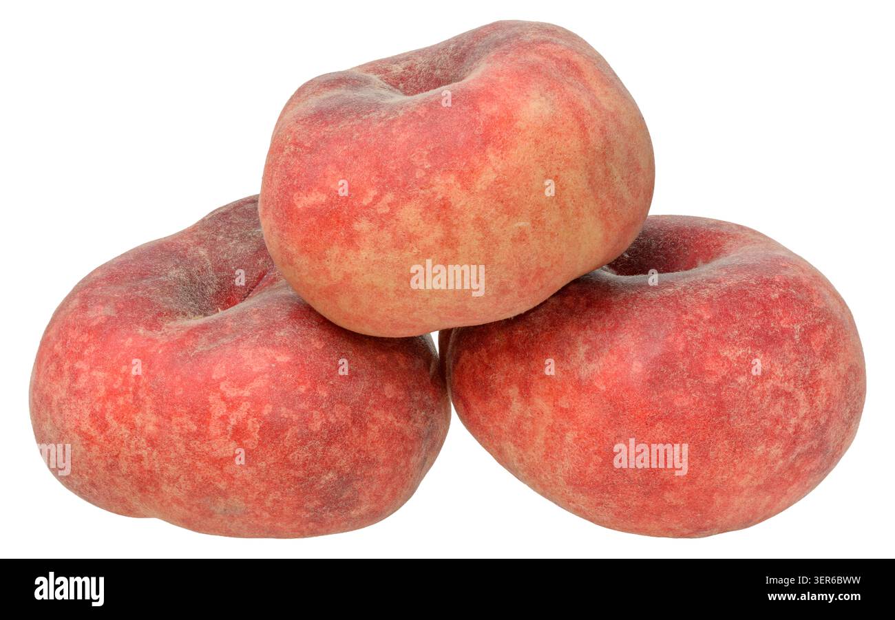 Stack of three whole ripe fig flat peaches with velvety skin, isolated background. Stock Photo