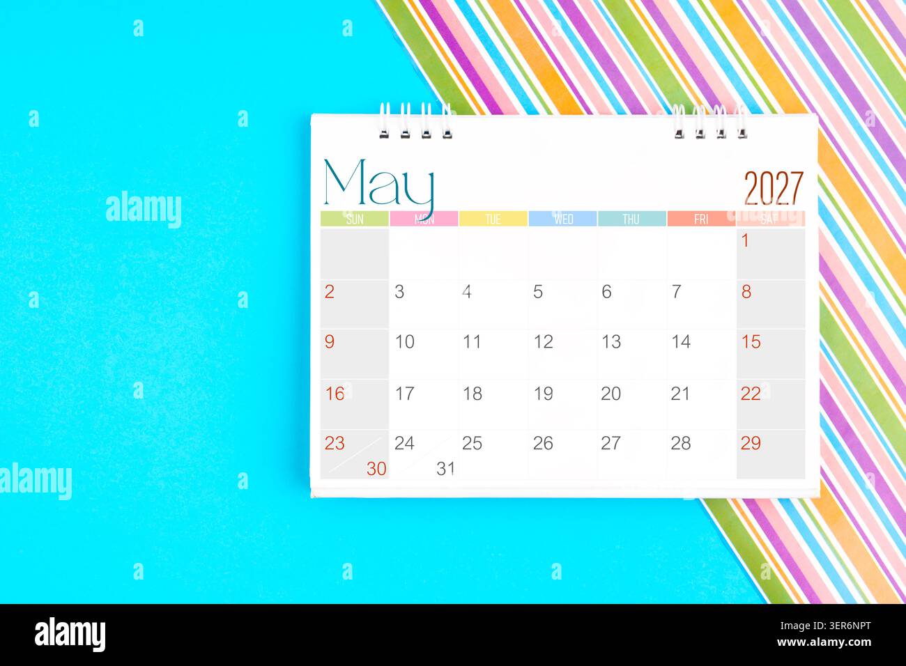 May 2027 desk calendar on yellow background, Front view Stock Photo - Alamy